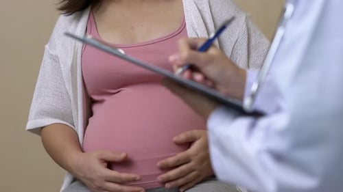 Pregnant Woman and Gynecologist Doctor at Hospital