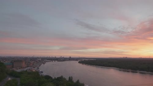 Sunrise Sky Over River and City