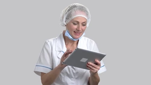 Nurse or Doctor Using Digital Tablet.