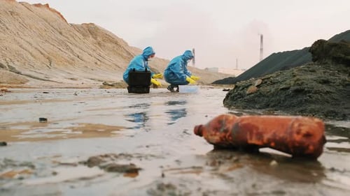 Scientists Collect Environmental Samples in Barren Wasteland