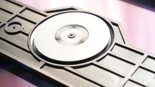 Compact disc medium inserting in player mechanism 4K 2160p UltraHD footage - Colorful DVD disk in