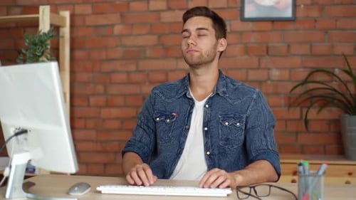Young Adult at Desk Types, Stretches, Massages Neck
