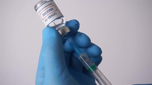Drawing Vaccine into a Syringe for Injection