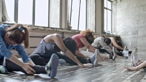 Women Stretching in Fitness Class