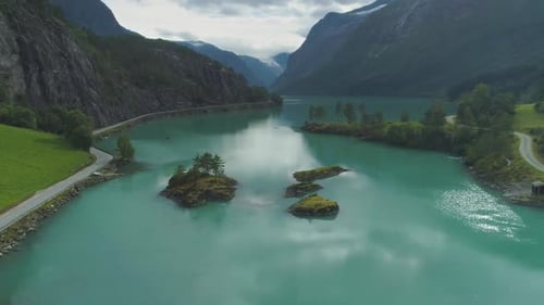 Lovatnet Lake with Turquoise Water and Green Islands. Beautiful Nature of Norway