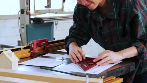 Pretty Carpenter student learning how to design wood construction in workshop