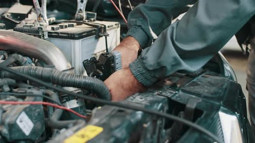 Mechanic Hands Repairing Complex Car Engine