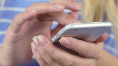 Adult Scrolls on Silver Smartphone