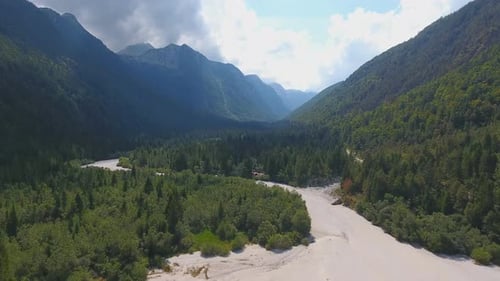 Aerial View of Dry Riverbed Near Lake Predil and Mountains in Background, Alps, Italy