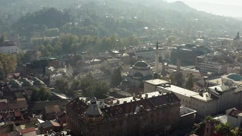 Drone Flying Over the Historic Mosque with a Minaret Standing in the City Center