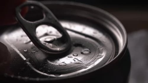 Close Up Slow Motion Opening of Metallic Silver Can in Droplets of Water. Low Key Lighting. Male