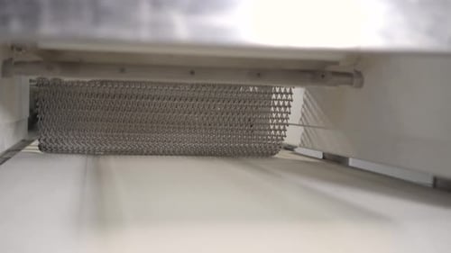 Making a Loaf of Bread in the Bakery. Loaf of Bread on the Production Line in the Baking Industry