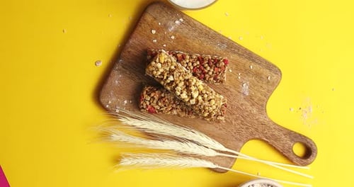 Delicious Granola Bar Breakfast on a Yellow Background