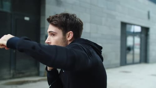 Male Boxer Training in Urban Environment
