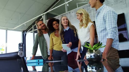 Happy Young Adults Collaborate in Modern Office