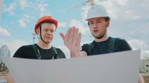 An Builders Are Studying Construction Plan and Analyze Are Building Construction