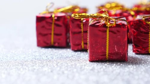 Red Present Decorations on Silver Background
