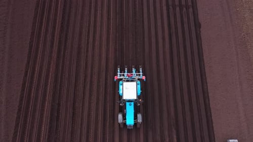 Tractor with Seeder in the Field