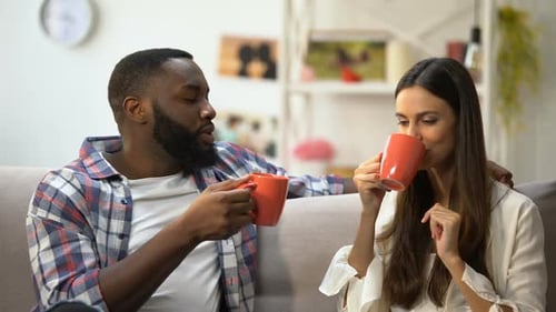 Happy Couple Enjoying Morning Coffee Together at Home