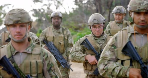 Front view of mixed-race military soldiers rifle training in fields during military training 4k