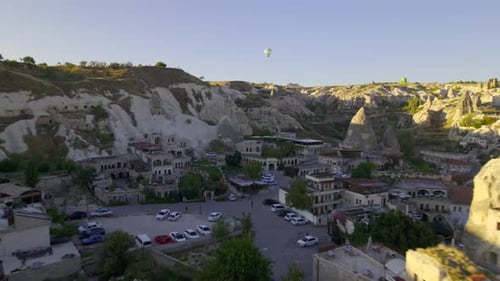 Sunrise and Hot Air Balloons Taking Off Over Valley