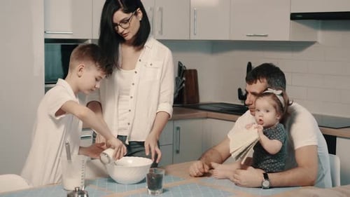 Family Baking Together in Modern Kitchen