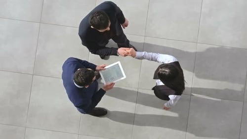 Businesswoman Joining Colleagues