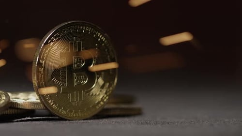 Cryptocurrency on the block chain - close up of bitcoin altcoin physical coins in dynamic setting