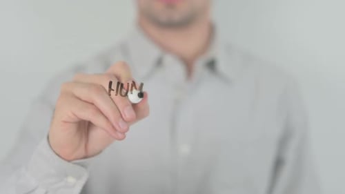 Hand Writing Humanitarian Aid on Glass With Marker