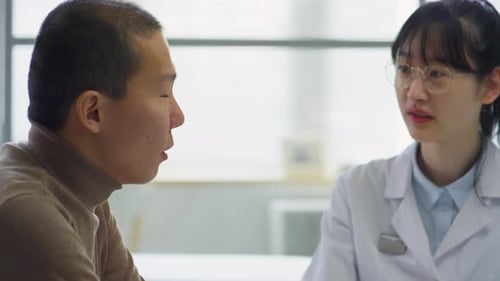 Doctor and Patient Meeting in Office