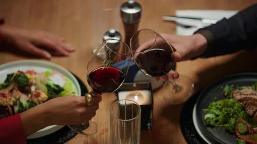 Fancy Couple Having Dinner at Restaurant Table on Night Date