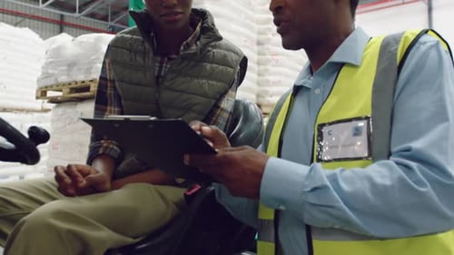 Workers interacting in a warehouse