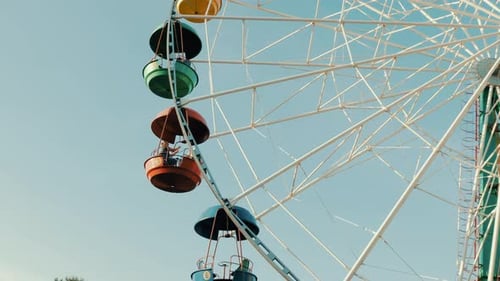 View of a ferris wheel over blue sky. Good weather