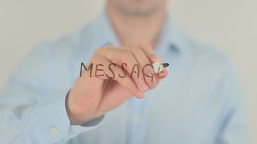 Man Writes Message on Clear Surface