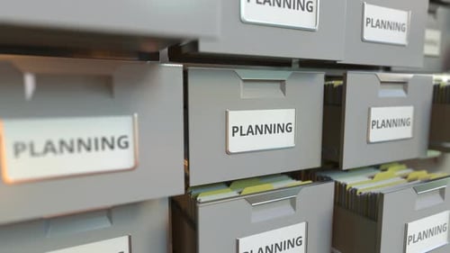 PLANNING Text on the Drawers of a File Cabinet