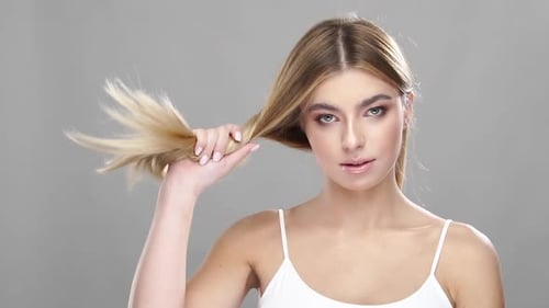 Beautiful Woman with Long Blond Hair Smiling