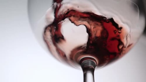 Pouring Red Wine into Wine Glass, Macro Shot