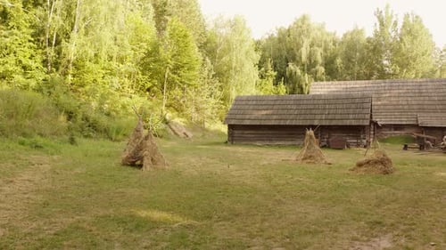 Historic Village Buildings with Drying Straw