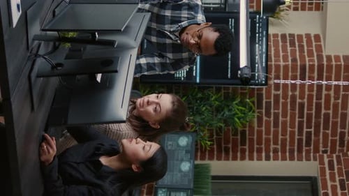 Team Discusses Coding at Modern Office Workplace