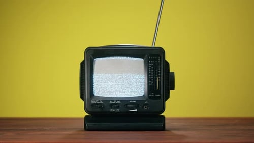 Retro Television Turns Off on Wood Table