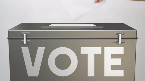 Paper Ballot Deposited in Metallic Vote Box