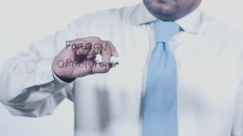 Asian Businessman Writes Foreign Opportunities 1