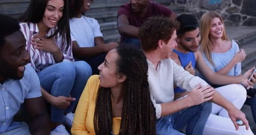 Happy diverse people using mobile phonesHappy diverse people using mobile phones outdoor