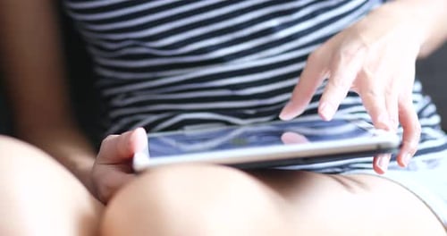 Woman Using Tablet Indoors Close Up