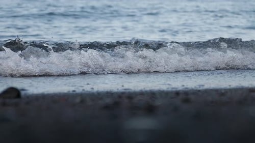 Wave Roll Into Beach