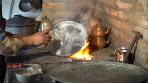 Craftsman Burnishing Silver Plate in Workshop