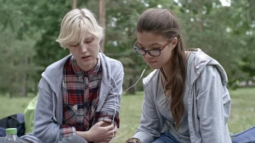 Friends Listen to Music Together Outdoors
