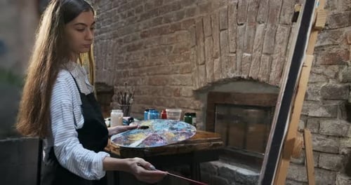 Artist Painting in Urban Studio