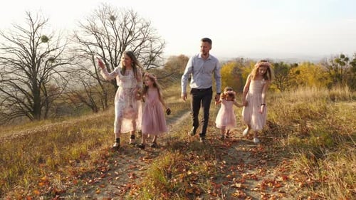 Family walking on a hill