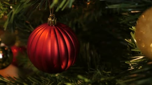 Detailed red Christmas tree decoration close-up 4K 2160p 30fps UltraHD footage - Decorative bauble